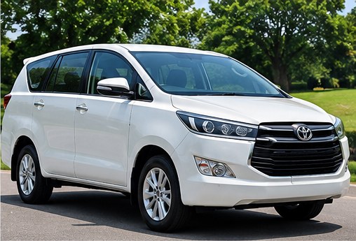White Toyota Innova Crysta, the kind of SUV used for a 7+1 family trip.